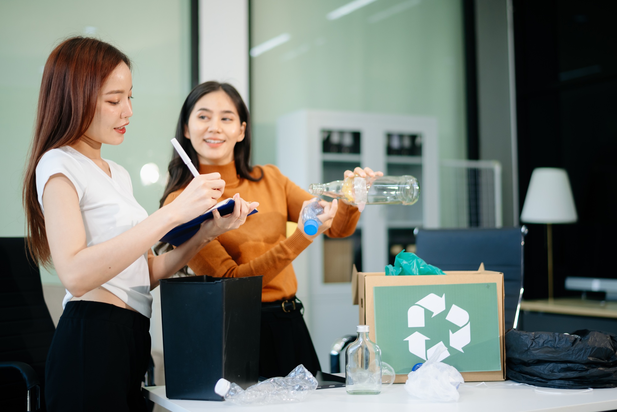 Eco friendly teamwork with this office recycling scene. Perfect for showcasing sustainability,