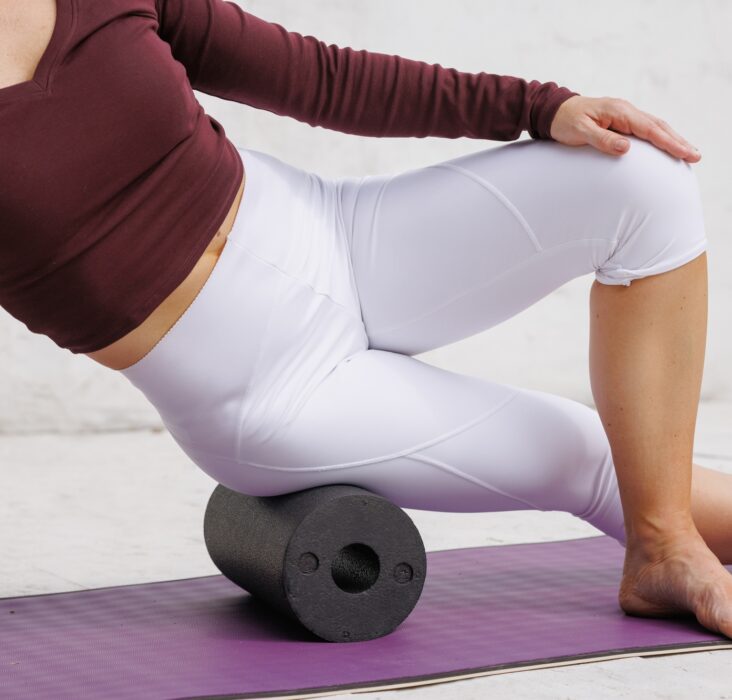 Foam roller massage for muscle recovery, stretching, flexibility, fitness, and wellness.