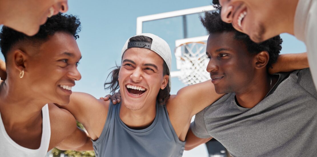 Happy, motivation and team building on a basketball court for a fitness mindset, teamwork and plann
