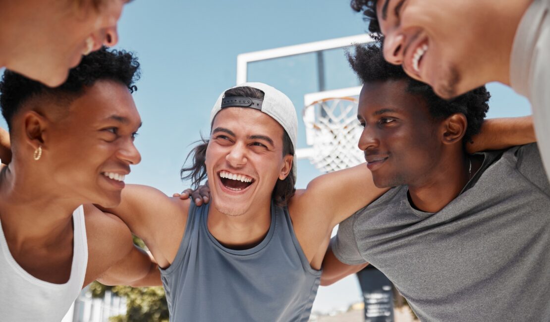 Happy, motivation and team building on a basketball court for a fitness mindset, teamwork and plann