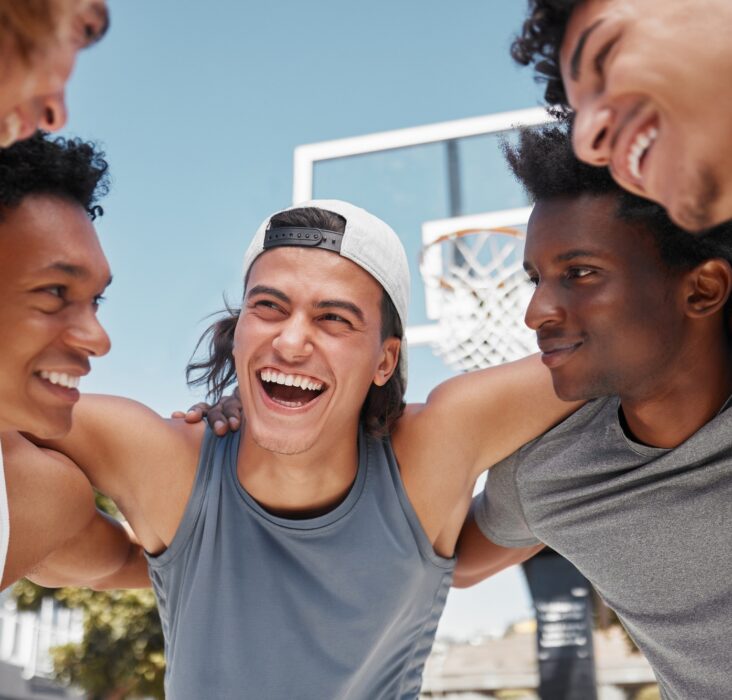 Happy, motivation and team building on a basketball court for a fitness mindset, teamwork and plann