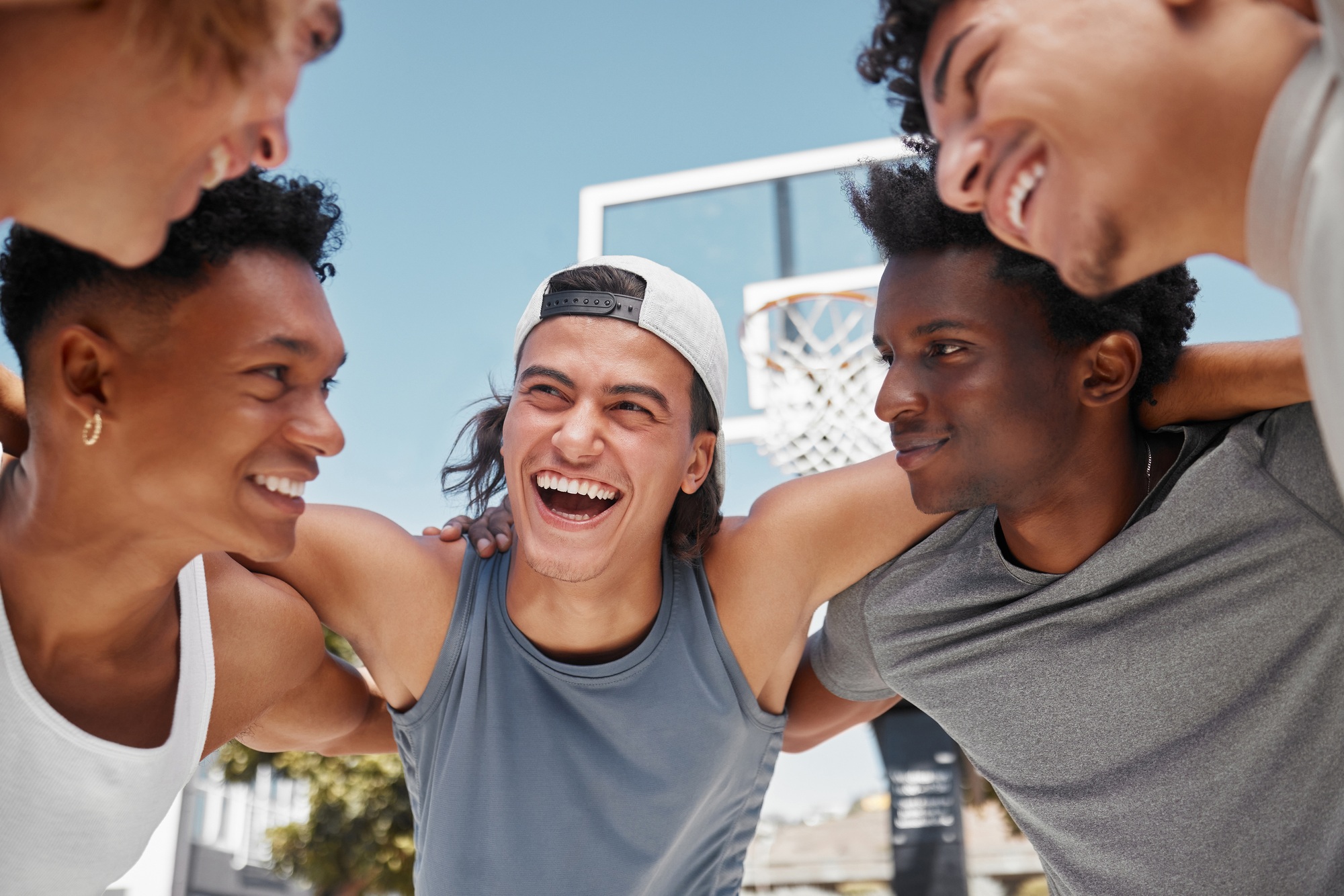 Happy, motivation and team building on a basketball court for a fitness mindset, teamwork and plann