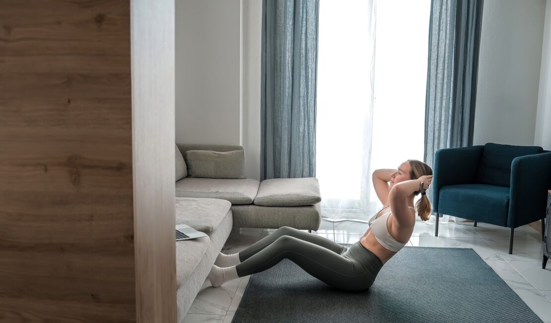 home workout, mindfulness, wellness.Young woman practicing home workout dumbbells during fitness