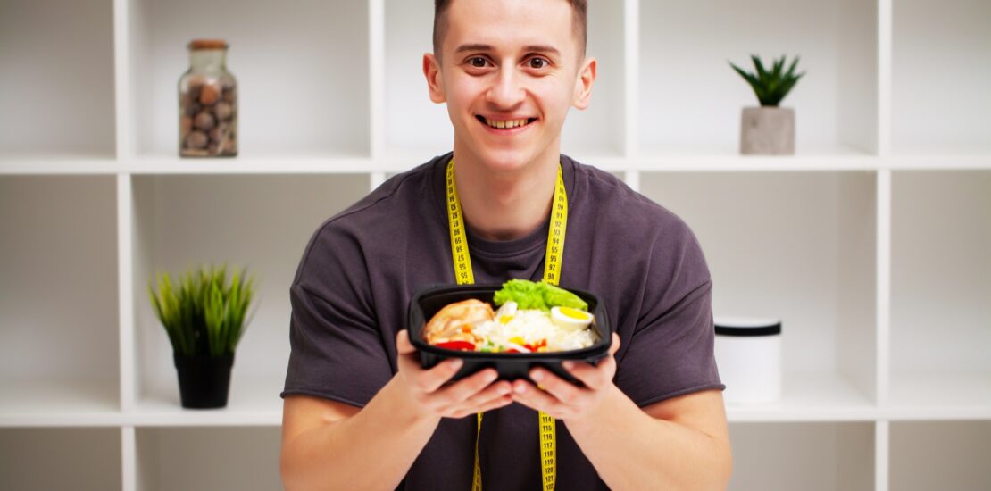 Trainer consumes a high-protein meal of meat and fruits.