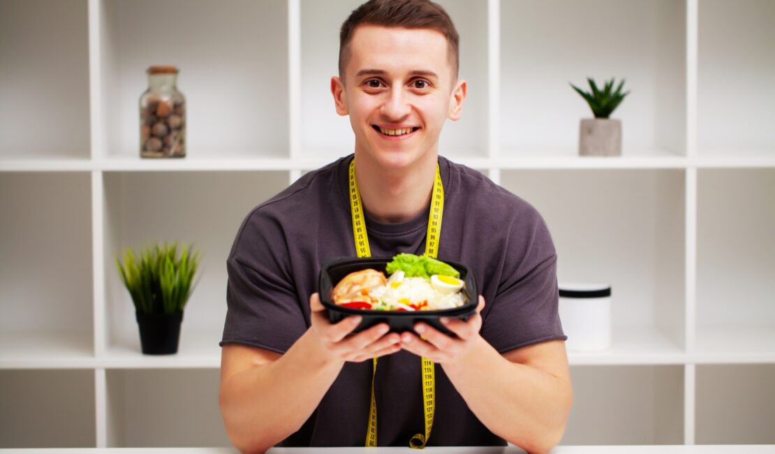 Trainer consumes a high-protein meal of meat and fruits.