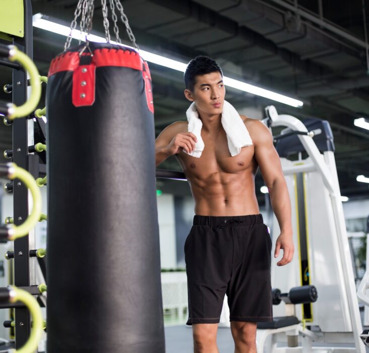 Young man resting at gym