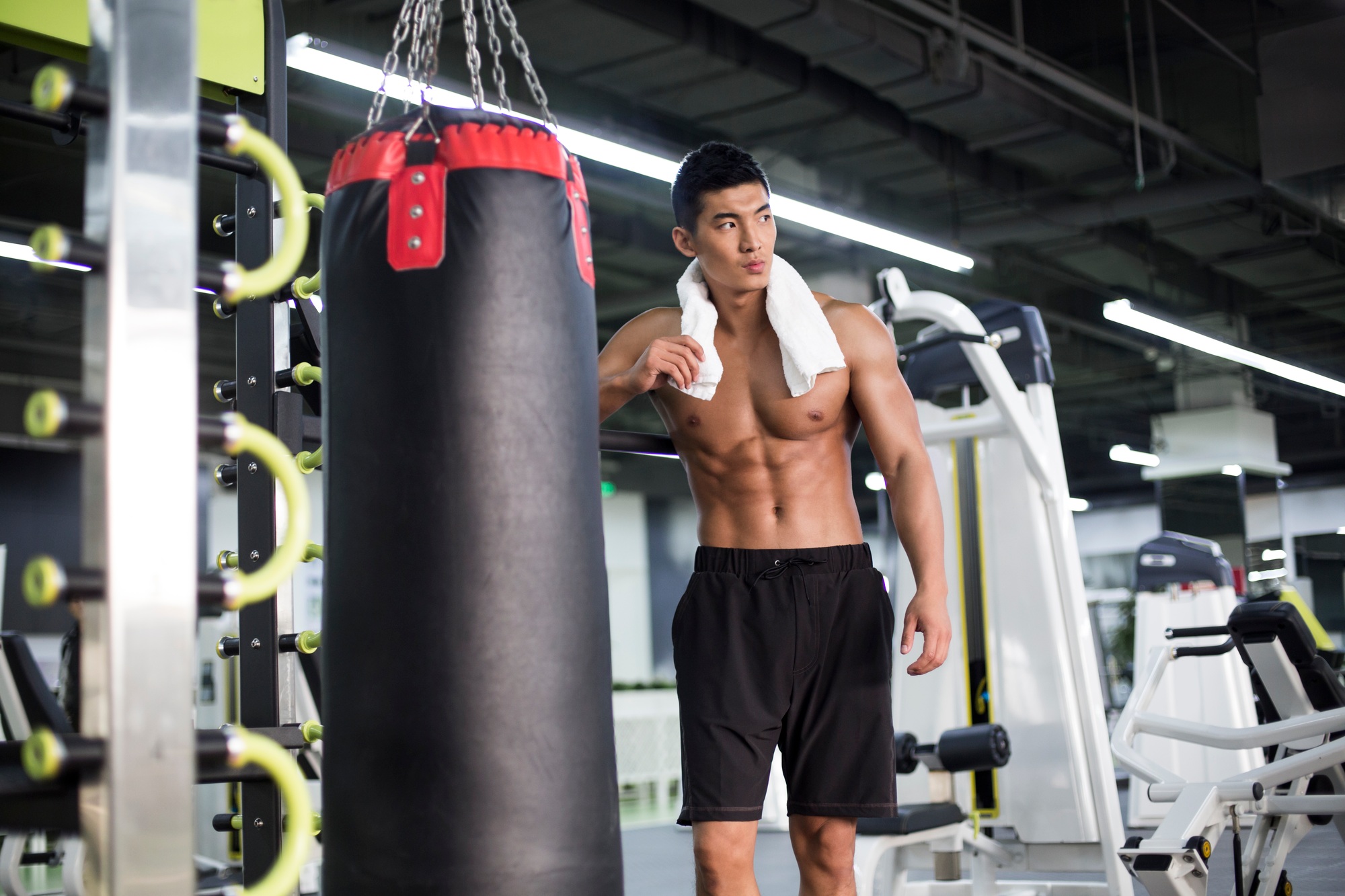 Young man resting at gym